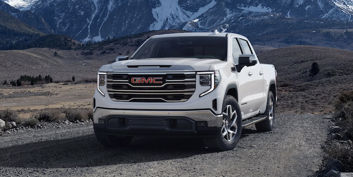 white 2024 GMC Sierra 1500 parked in the mountain