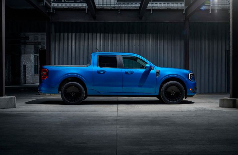 Blue 2025 Ford Maverick Lobo Side Exterior in a Warehouse at Night