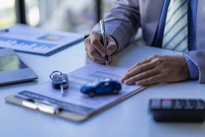signing paperwork and car buying tips 2023