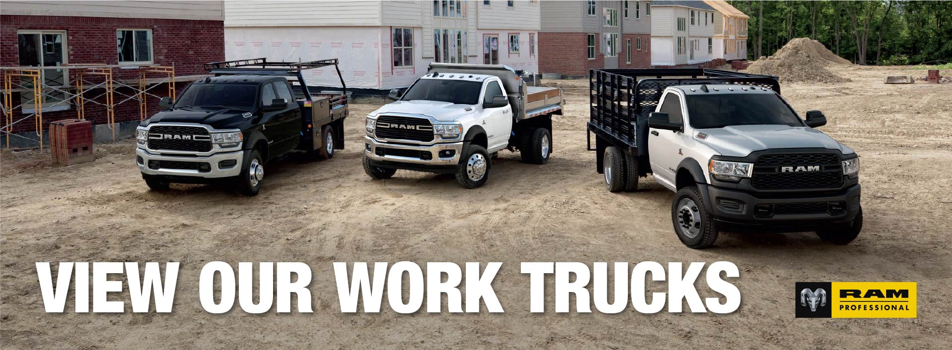 Three Ram Chassis Cab work trucks with flatbed, dump and stake bodies at a job site. View our work trucks.