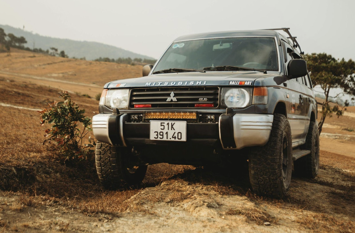 An image of a 4WD vehicle on an open, off-road trail