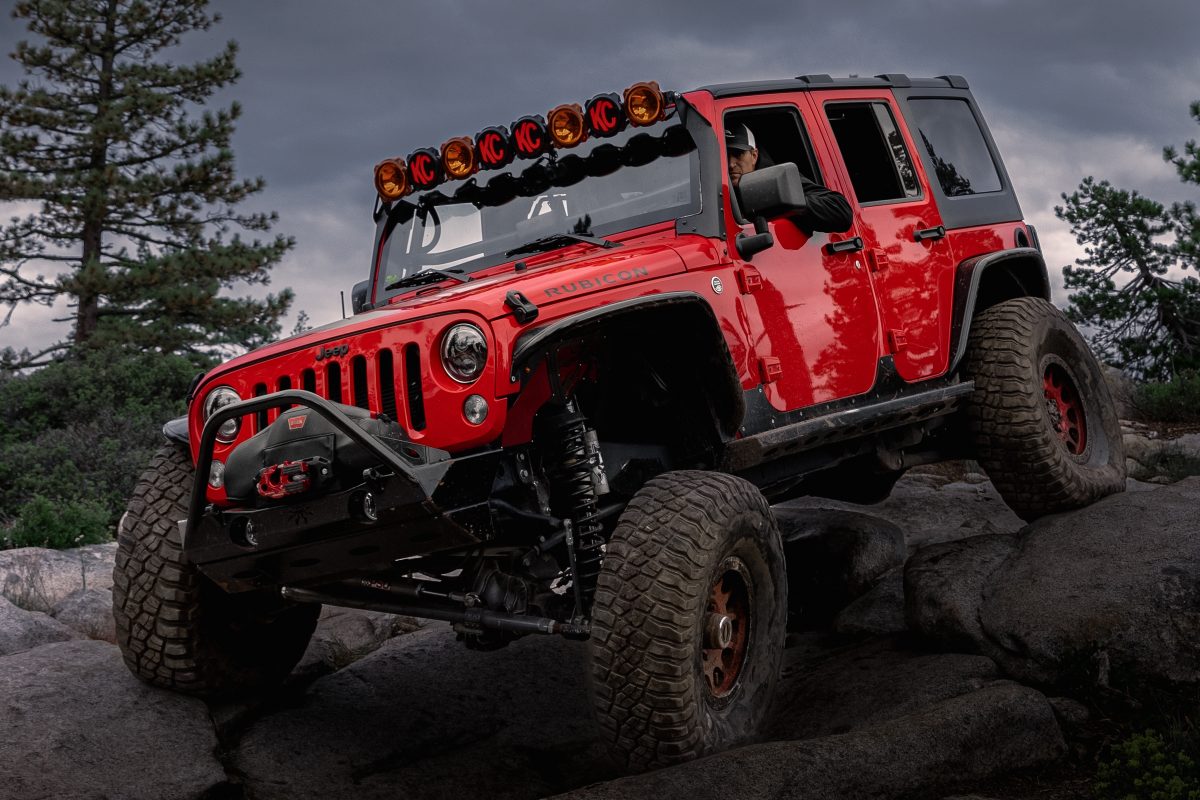 Red Lifted Jeep Rock Crawling