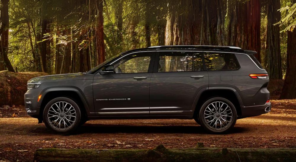Grey 2024 Jeep Grand Cherokee L parked in the woods