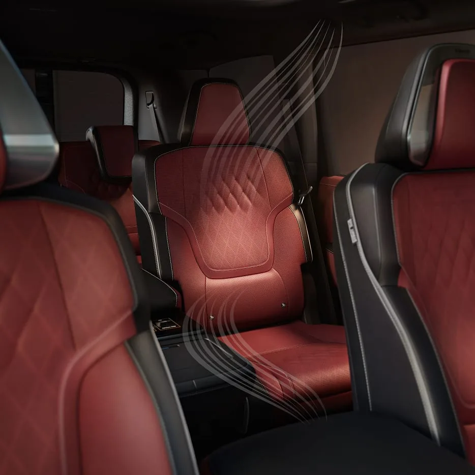 Second-row burgundy quilted captain’s chair in the 2027 INFINITI QX80 with translucent white airflow lines illustrating biometric cooling across the seat.