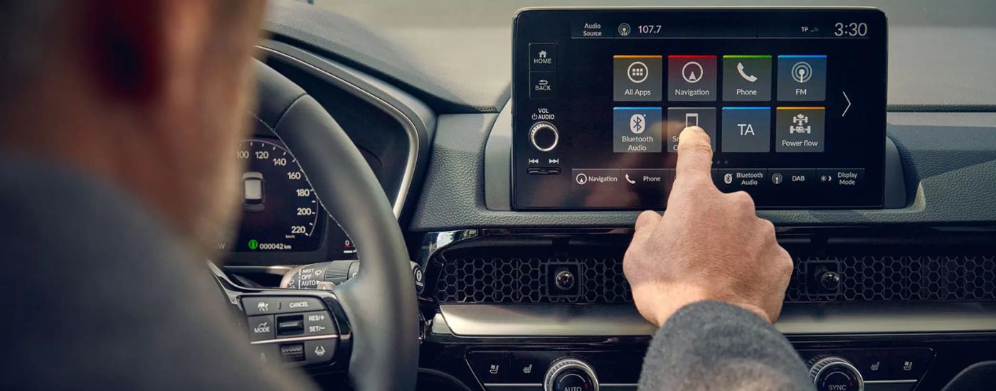 Person using infotainment screen in a 2026 Honda CR-V Hybrid