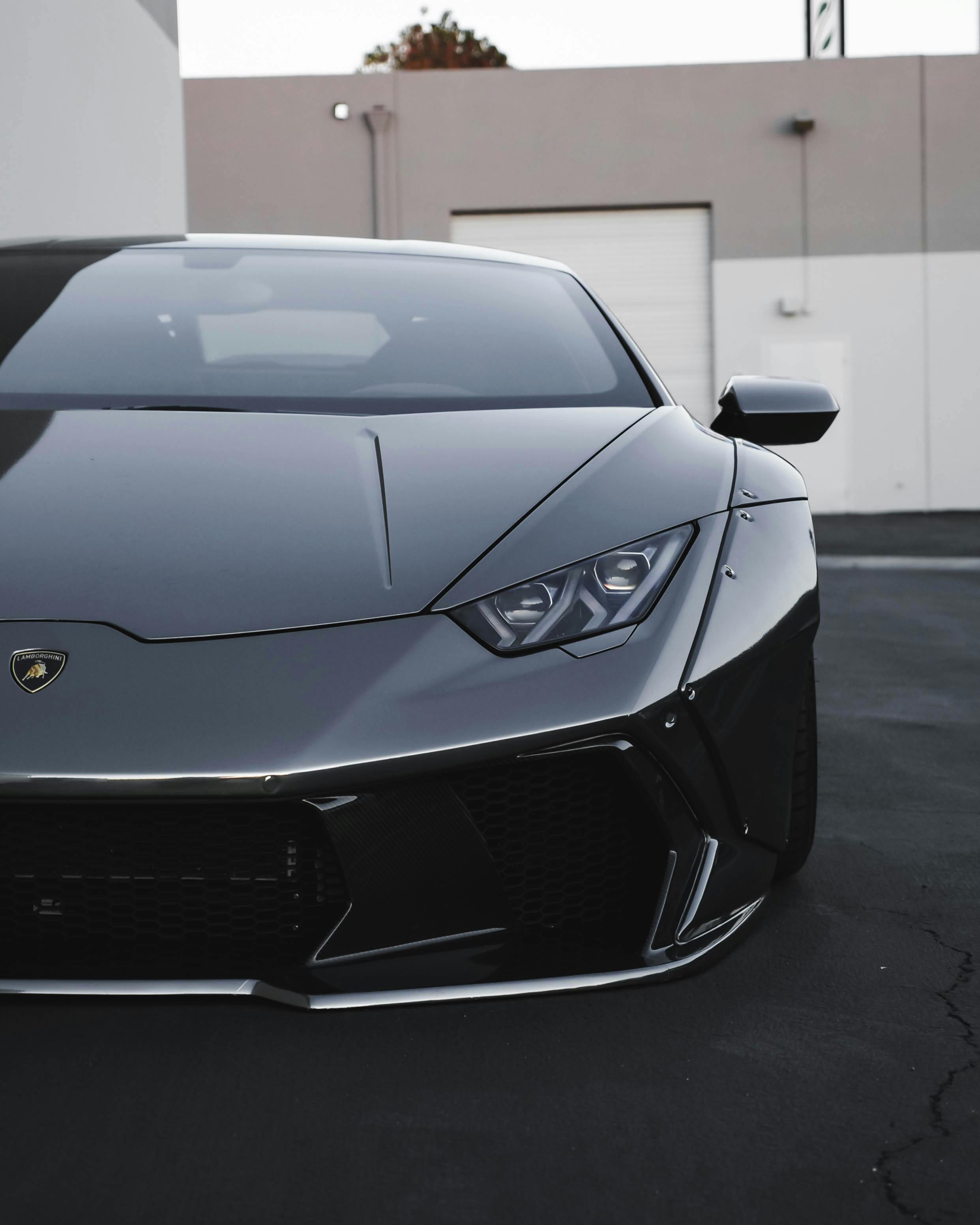 Red SUV driving at sunset on an open road