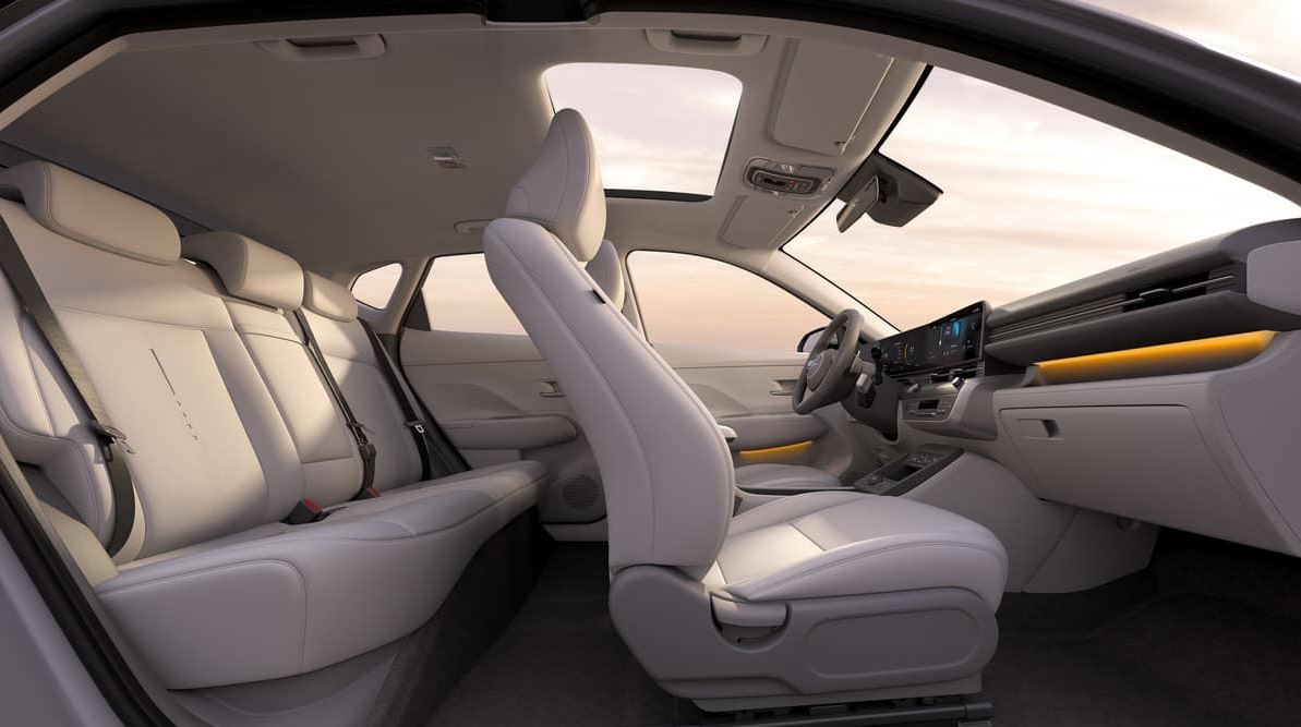 Spacious and modern interior of the 2024 Hyundai Kona with comfortable seating and panoramic sunroof.