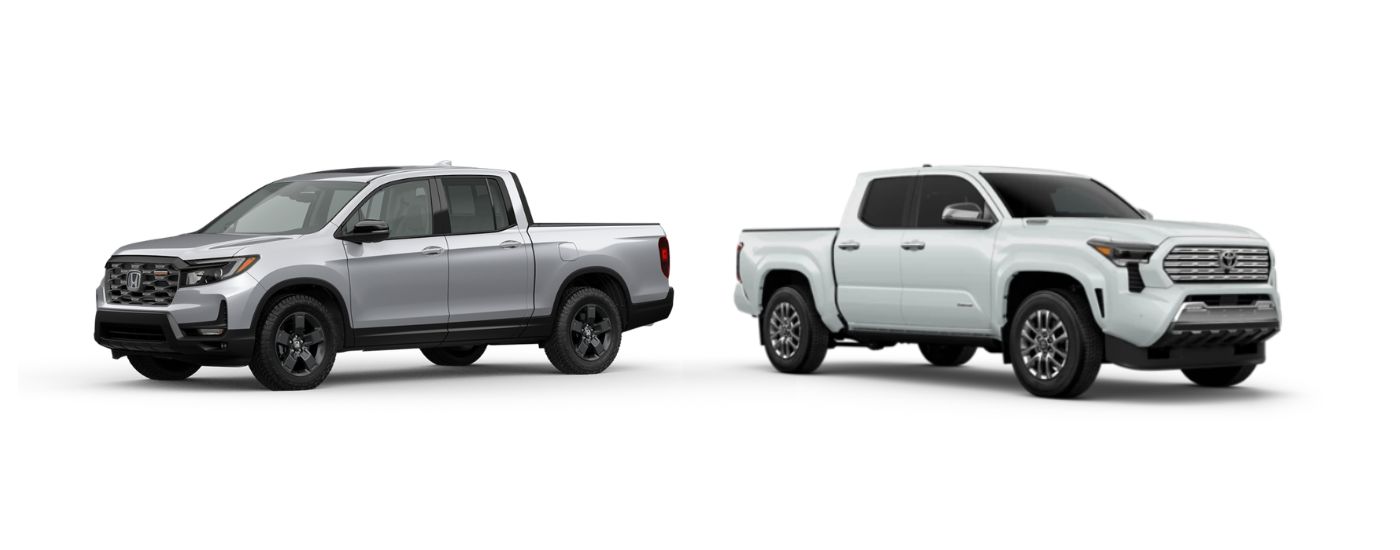 A silver 2026 Honda Ridgeline angled left and a white 2026 Toyota Tacoma angled right.