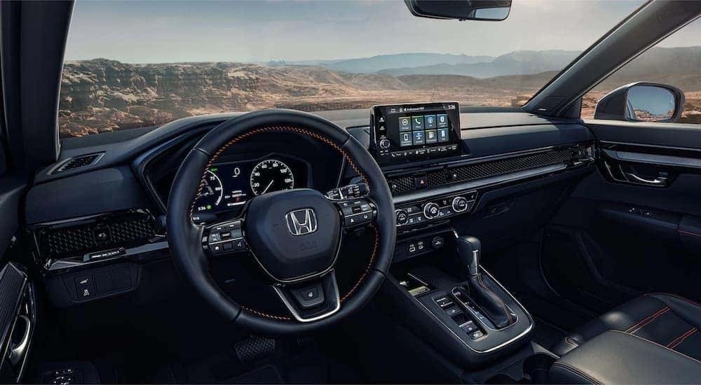 Black interior of a 2023 Honda CR-V from the driver's seat
