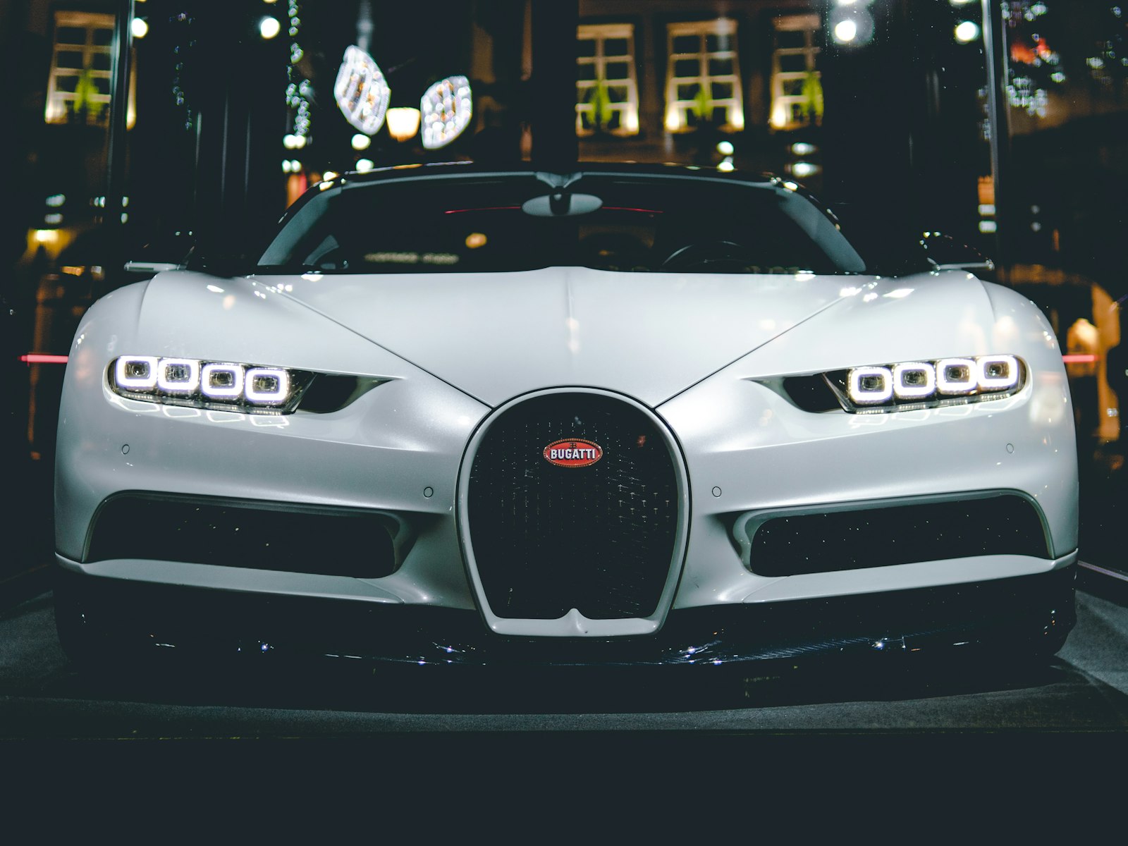 Two pickup trucks on a road, illustrating a model comparison