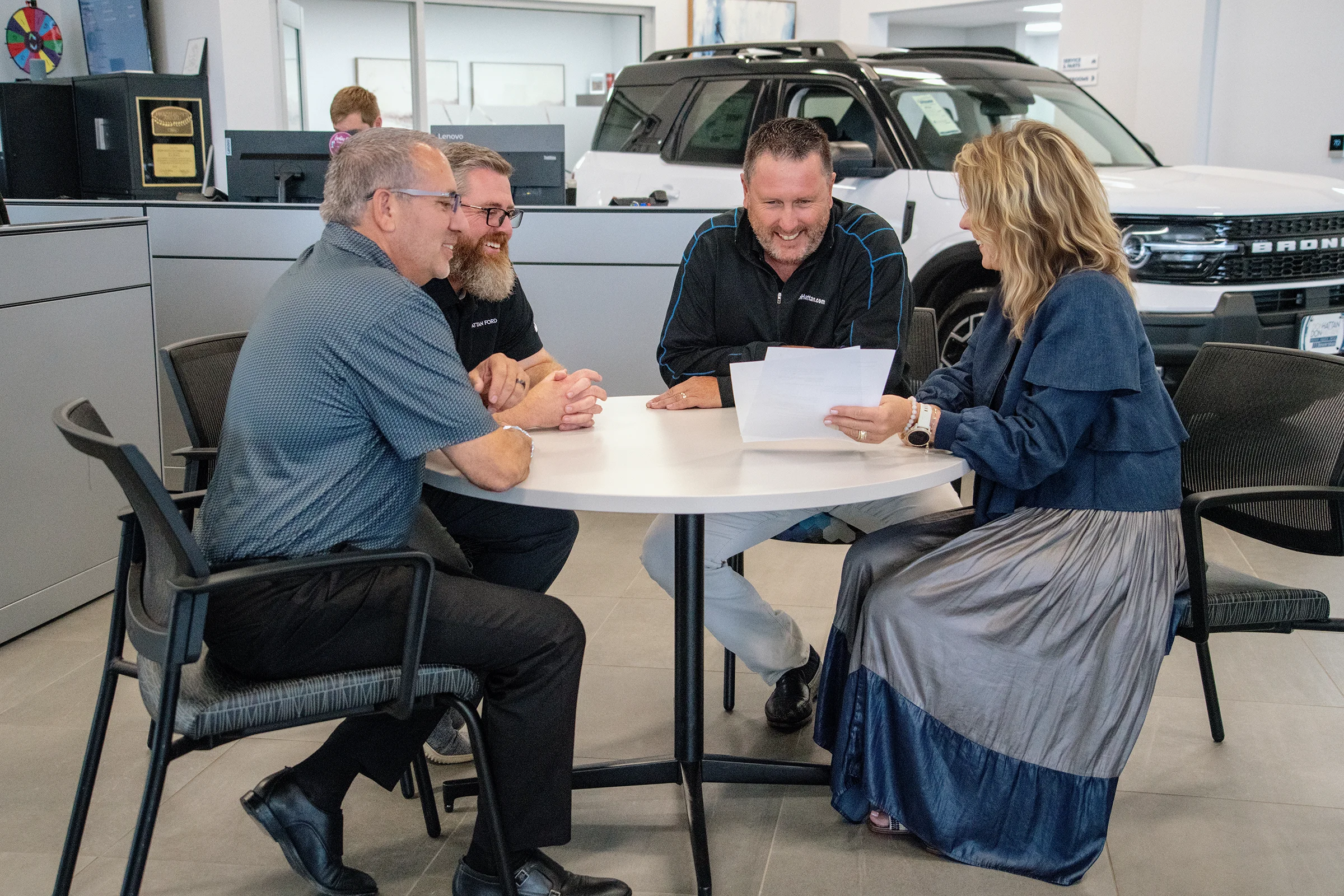 Jill Hattan, CEO, and Ben Thomas going over Ford Credit standards and information with Sales Managers at Don Hattan Ford