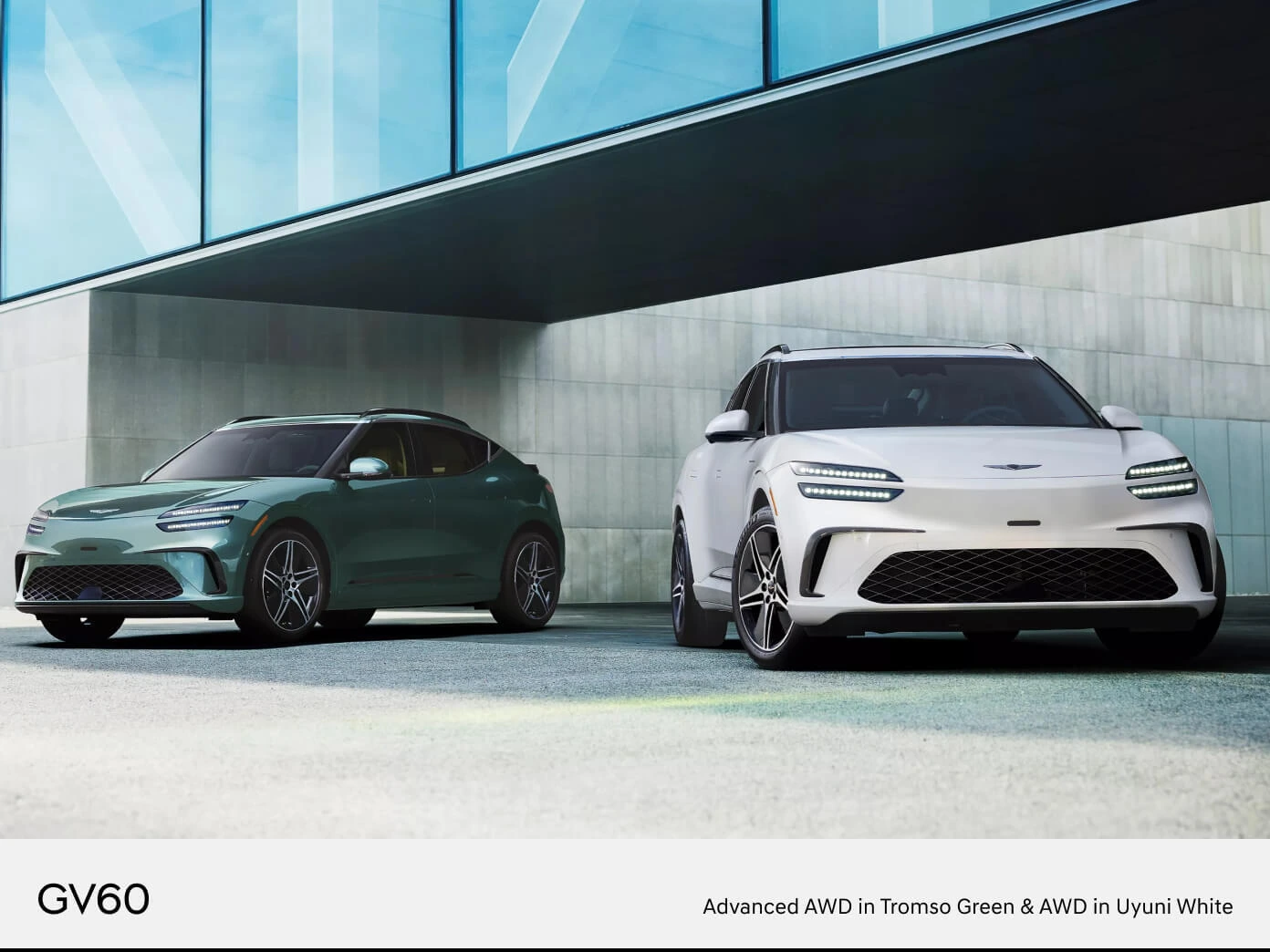 Front three-quarter view of two 2026 Genesis GV60 models, one Advanced AWD in Tromso Green and one AWD in Uyuni White.