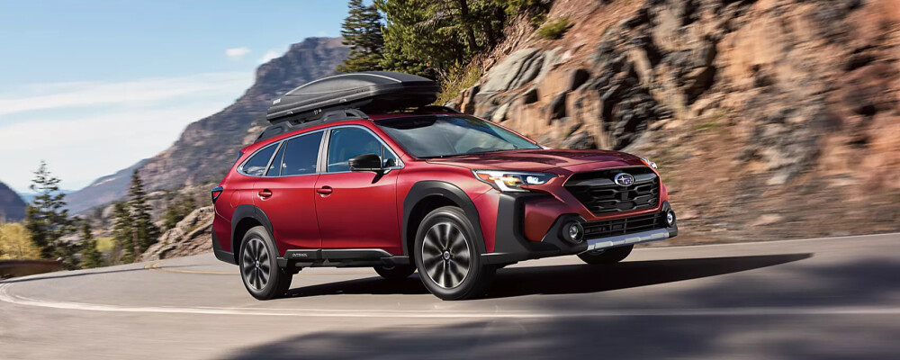 2025 Subaru Outback driving through mountain roads