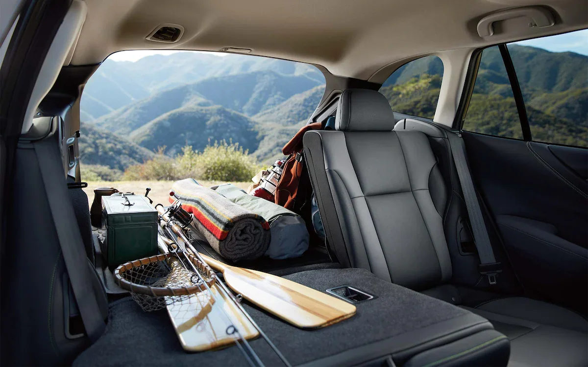 A view from inside the 2022 Subaru Outback showing the cargo area filled with outdoor gear and part of the rear seat folded down.