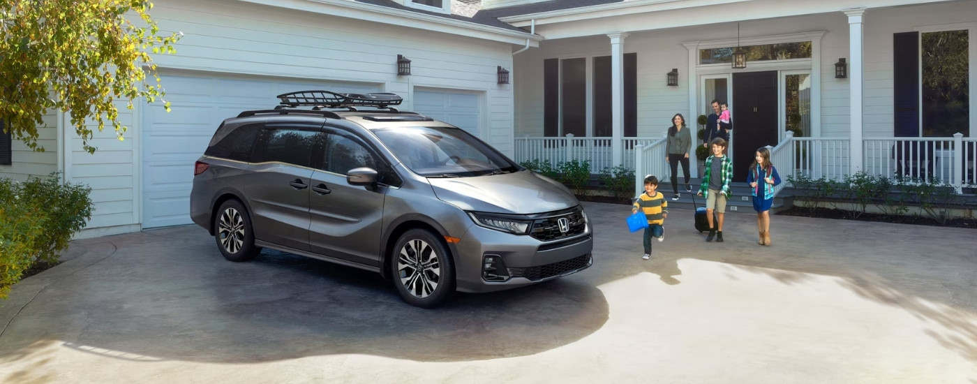 silver 2025 Honda Odyssey parked near a family