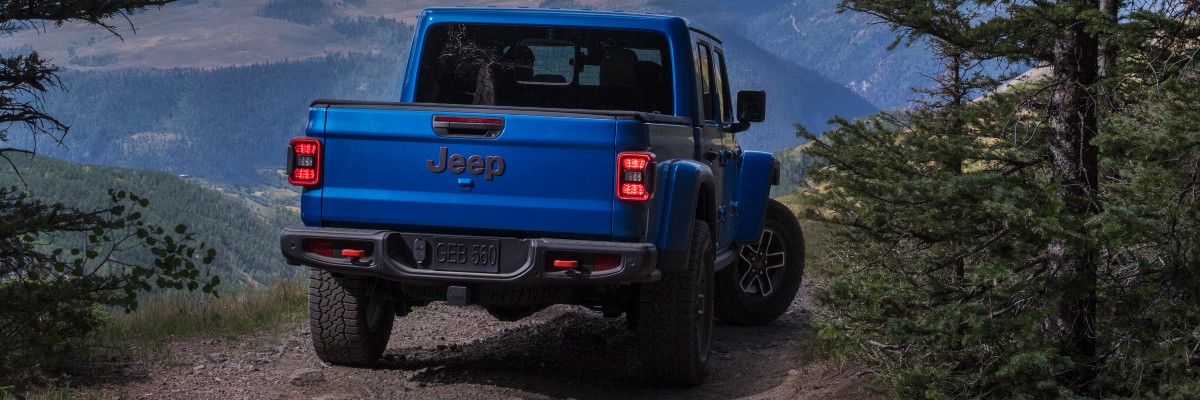 2025 Jeep Gladiator Exterior Passenger Side Rear Angle on Trails