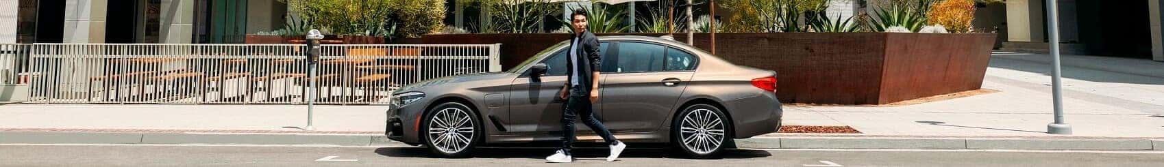 BMW 5 Series cruising through the city