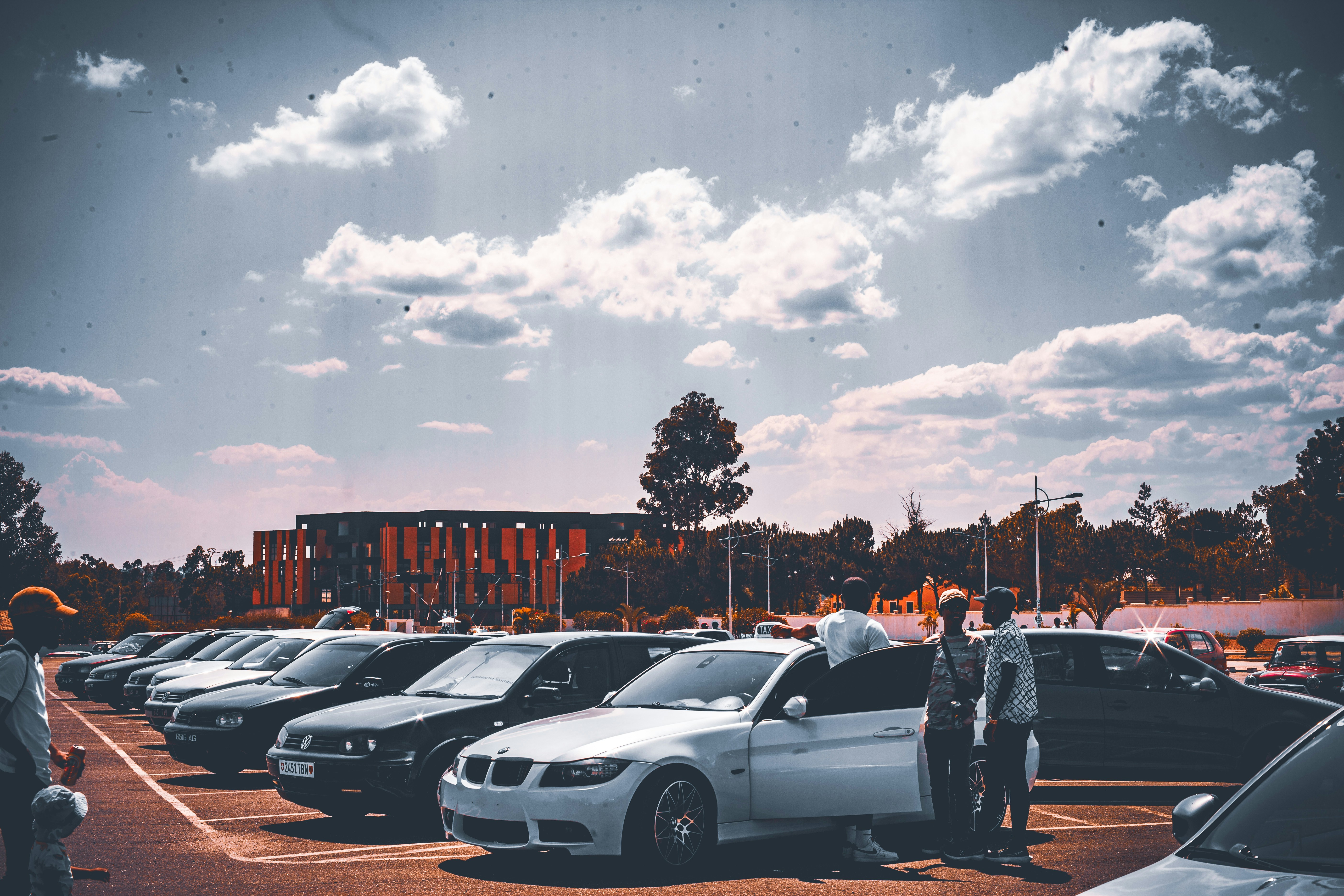 Auto sales exterior shown with a lot a parked cars.