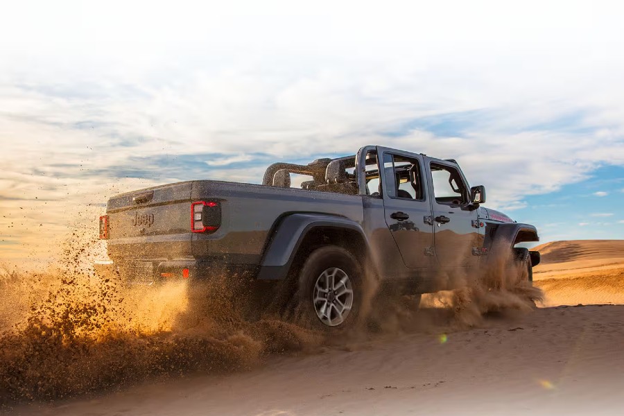 2026 Jeep Gladiator Exterior Passenger Side Rear Profile Throwing Sand