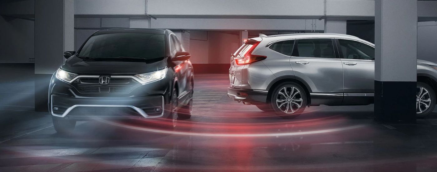 Silver 2020 Honda CR-V Touring reversing in a parking garage
