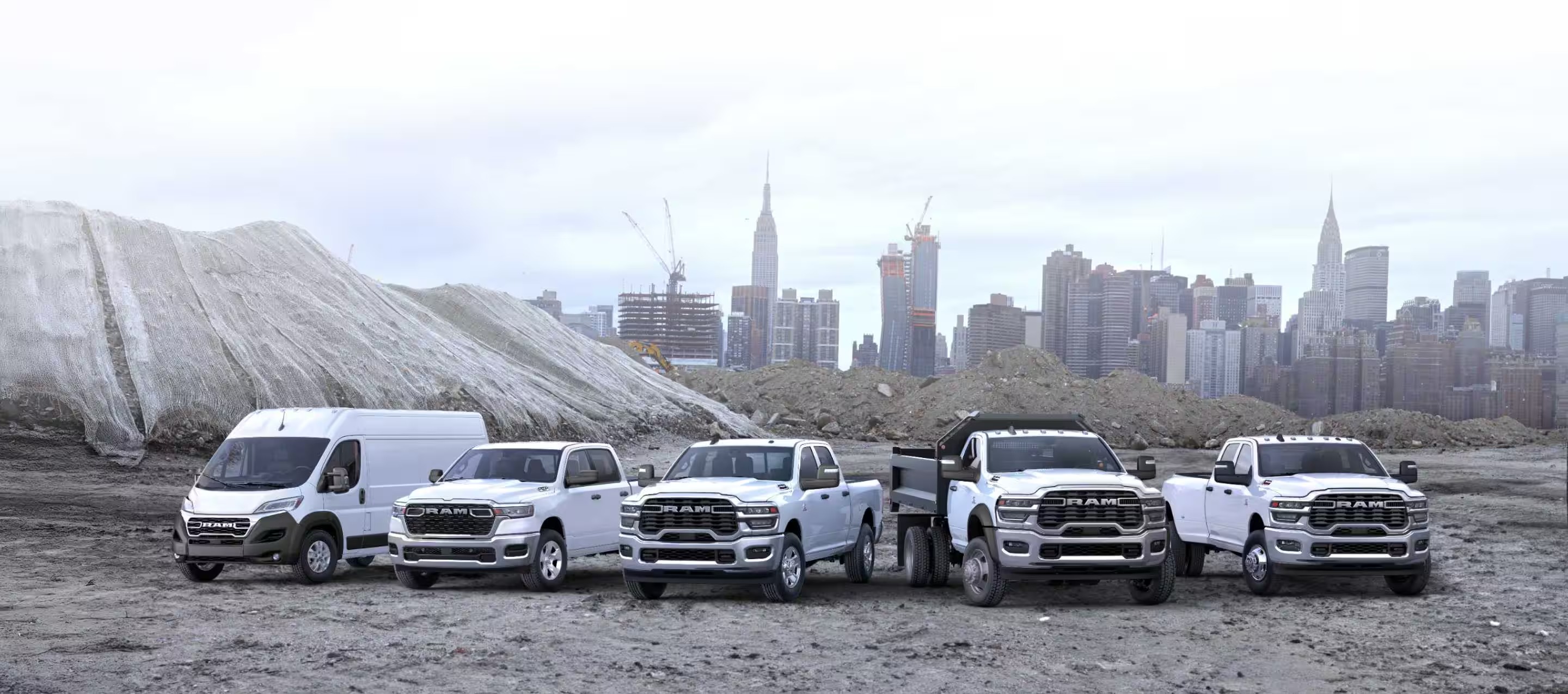 Ram Professional commercial trucks and vans lined up at a work site