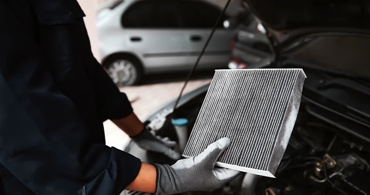 Technician testing a Subaru vehicle battery