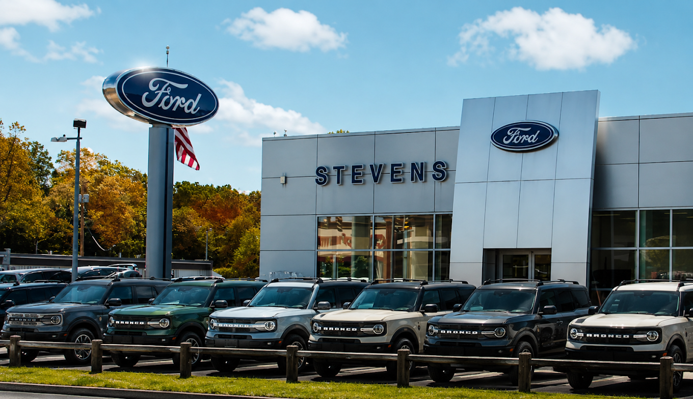 Modern Ford dealership exterior in Connecticut with a lineup of new Ford vehicles