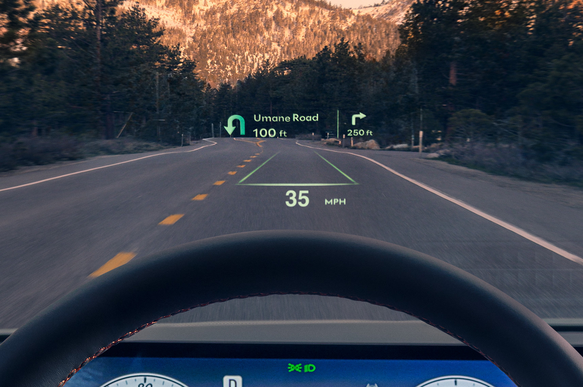 Interior close up of 27-inch OLED instrument cluster and navigation system inside Genesis G80