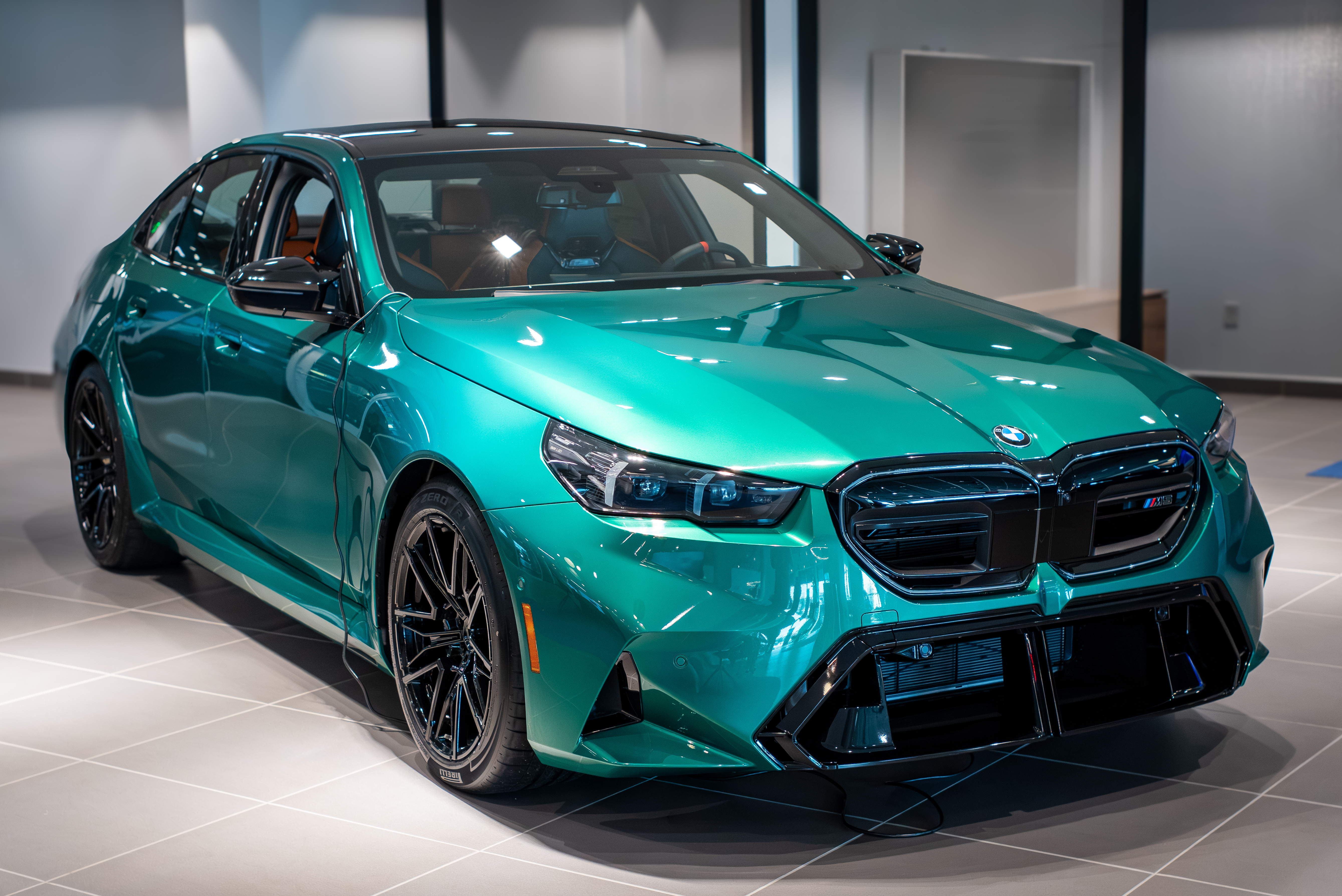 A green BMW M model in the BMW of Greensboro showroom
