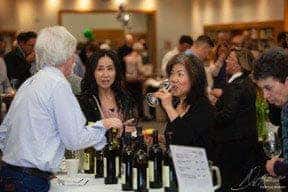 Guests at a wine tasting in the library