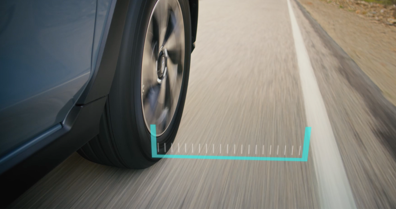 A Subaru detects lane markings with Lane Departure Warning activated.