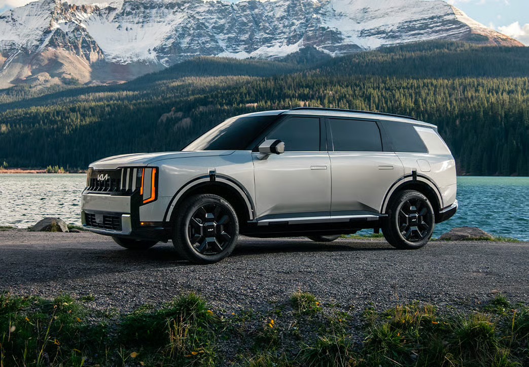 2027 Kia SUVs and sedans lined up, including the Telluride, Sportage, Sorento, and K4
