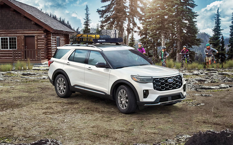 image of black ford explorer with rack loaded with camping gear