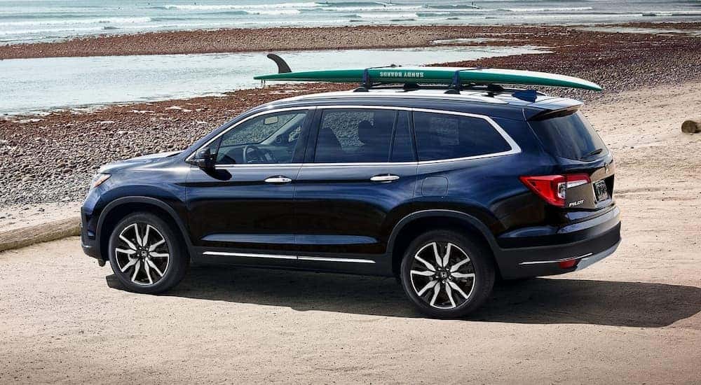 Dark blue 2022 Honda Pilot Elite parked by the ocean.