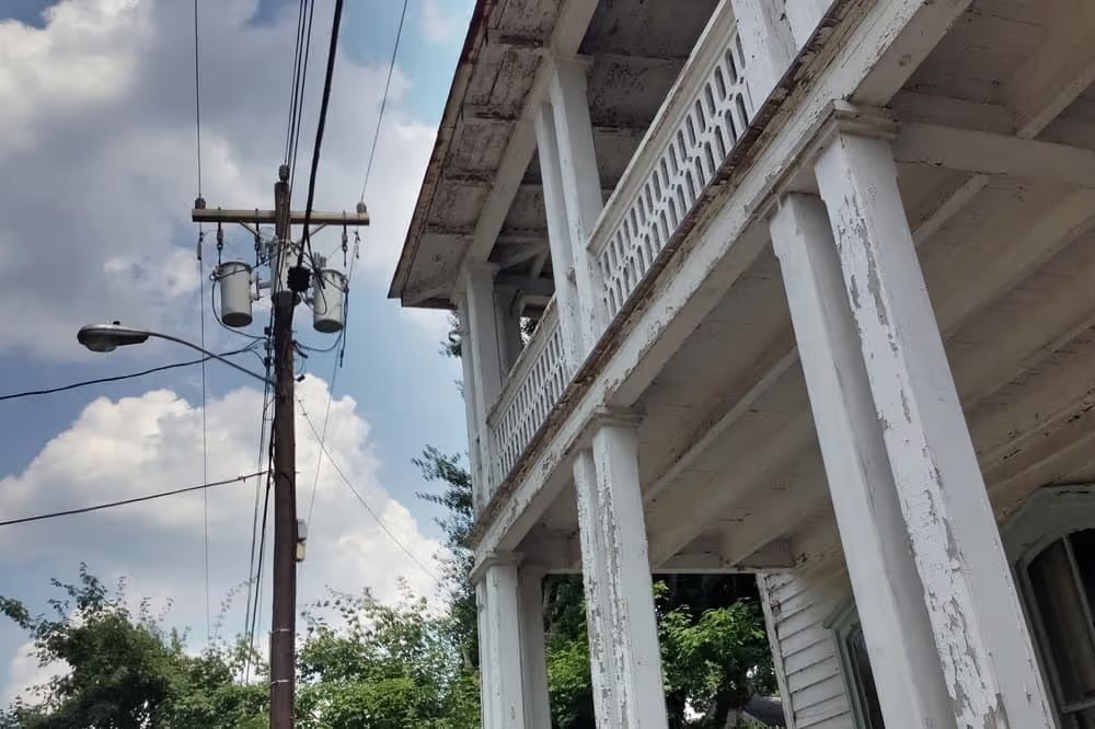 Historic house with white columns on a porch in Hillsborough