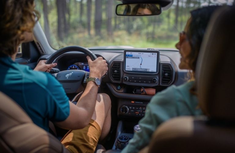 Man and Woman in Front Seats of 2024 Ford Bronco Sport