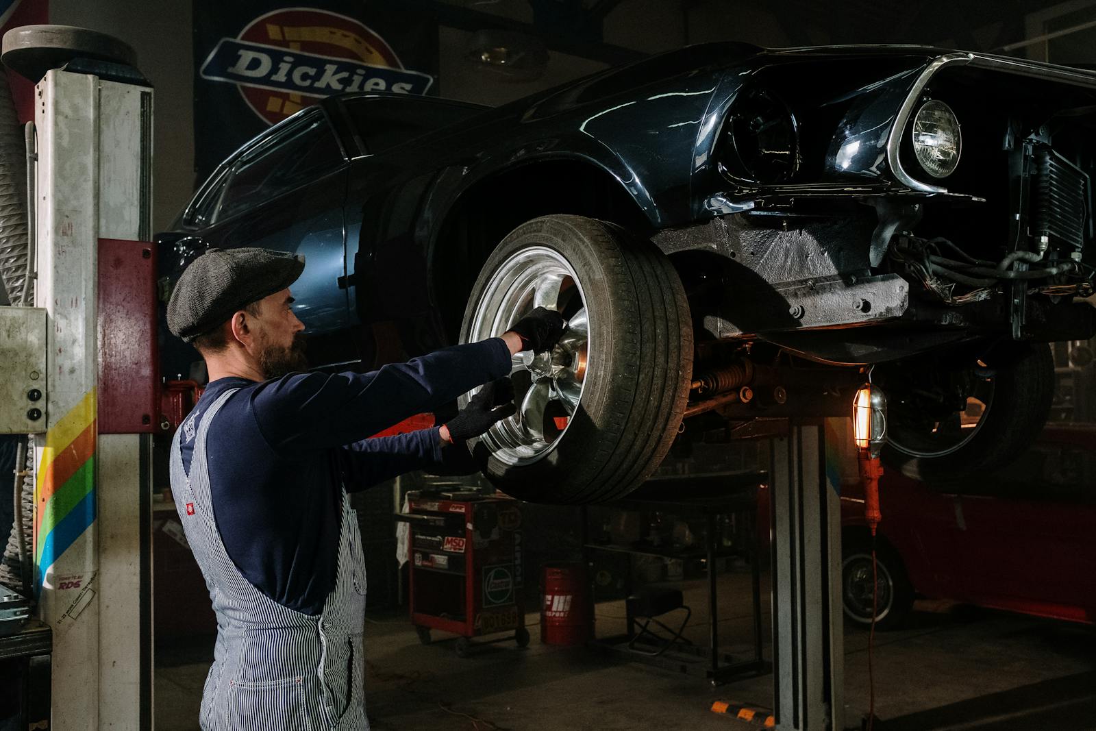 Certified technicians servicing a Ford SUV in a service bay