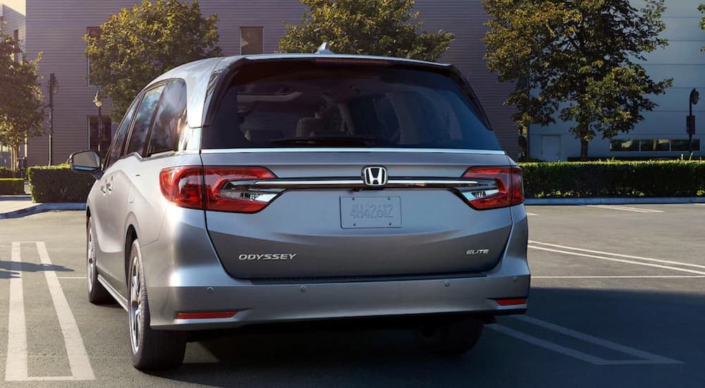 Rear of a grey 2024 Honda Odyssey parked on a parking lot.