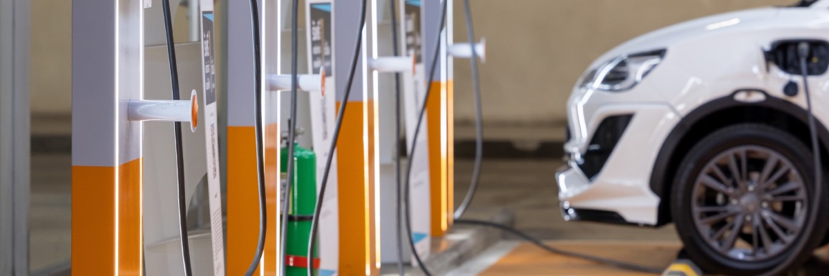 Electric Vehicle Plugged in at Charging Station
