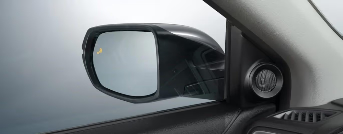 Illuminated blind spot monitoring icon on a 2021 Honda CR-V Touring