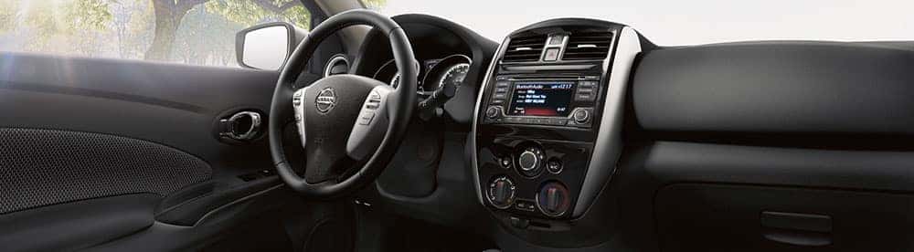2018 Nissan Versa sedan charcoal cloth front seats and dashboard