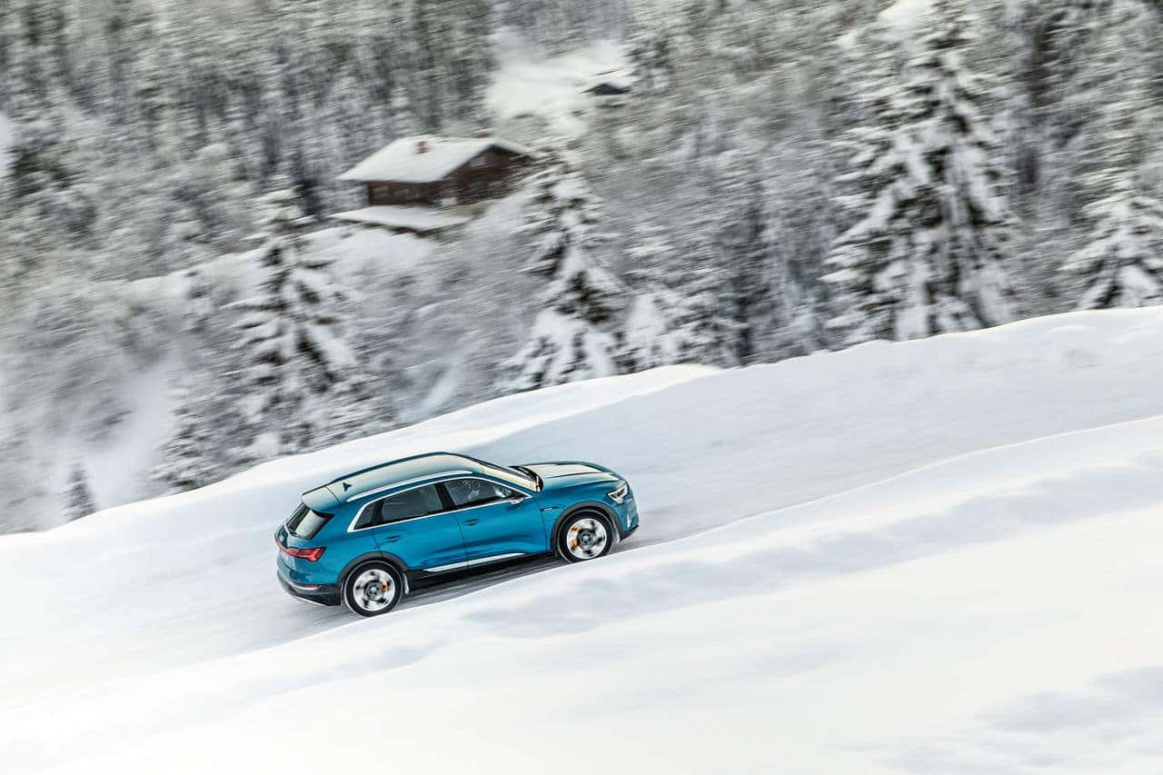How Do EVs Perform in the Snow? - Blue SUV Driving In The Snow