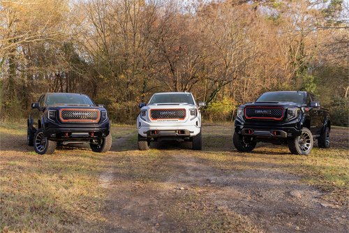 Harley Davidson Trucks sitting in a field