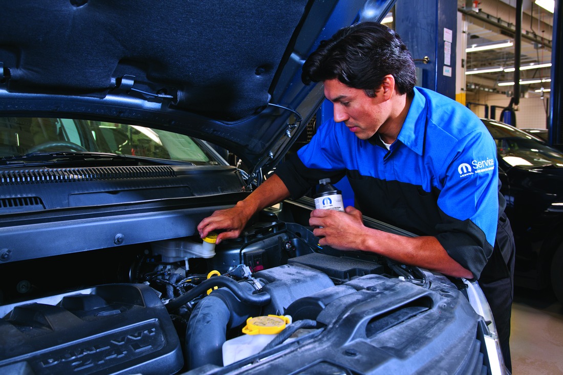 Man servicing a car