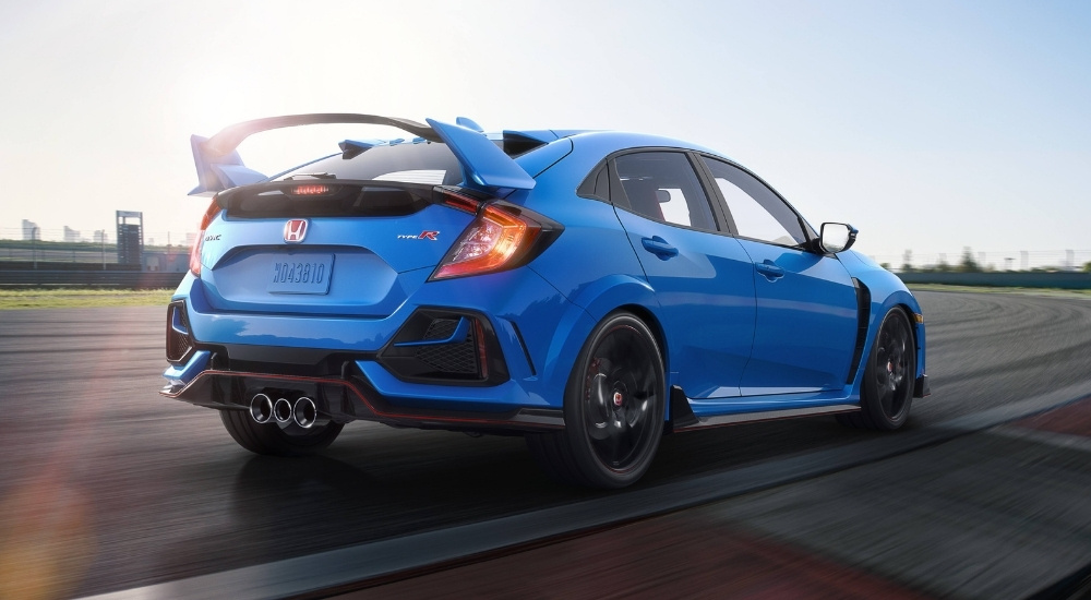 Blue 2020 Honda Civic Type R driving on a racetrack
