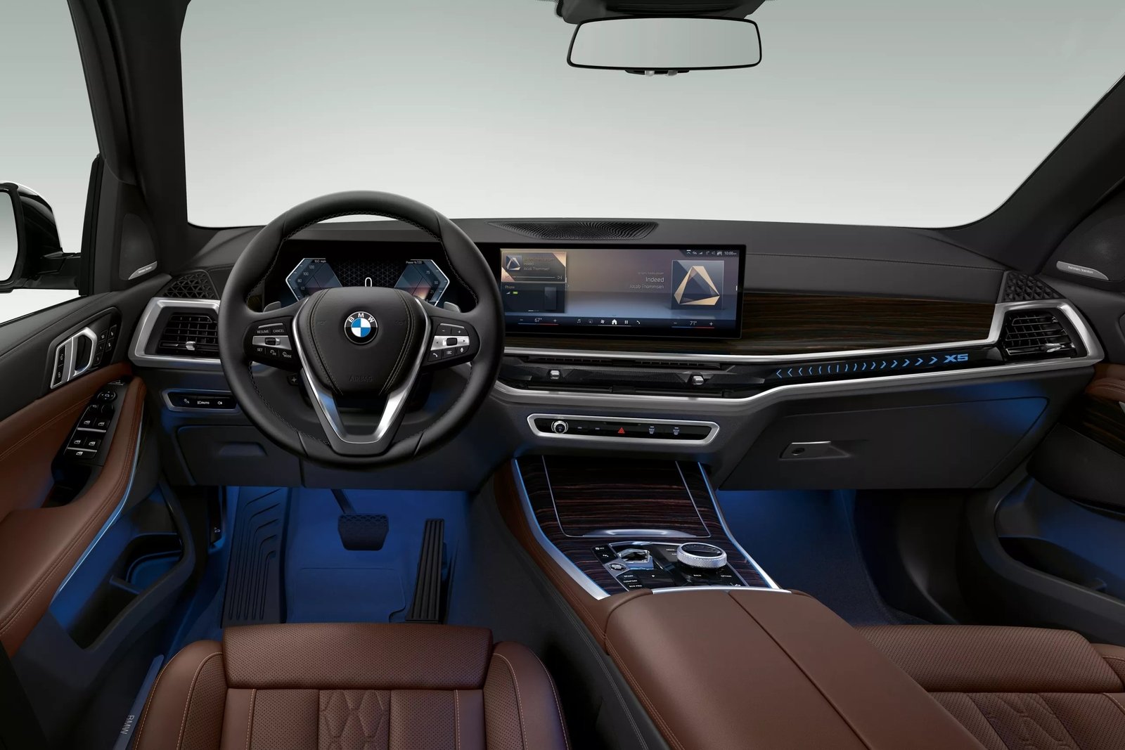 2026 BMW X5 shown above (left) with available features.