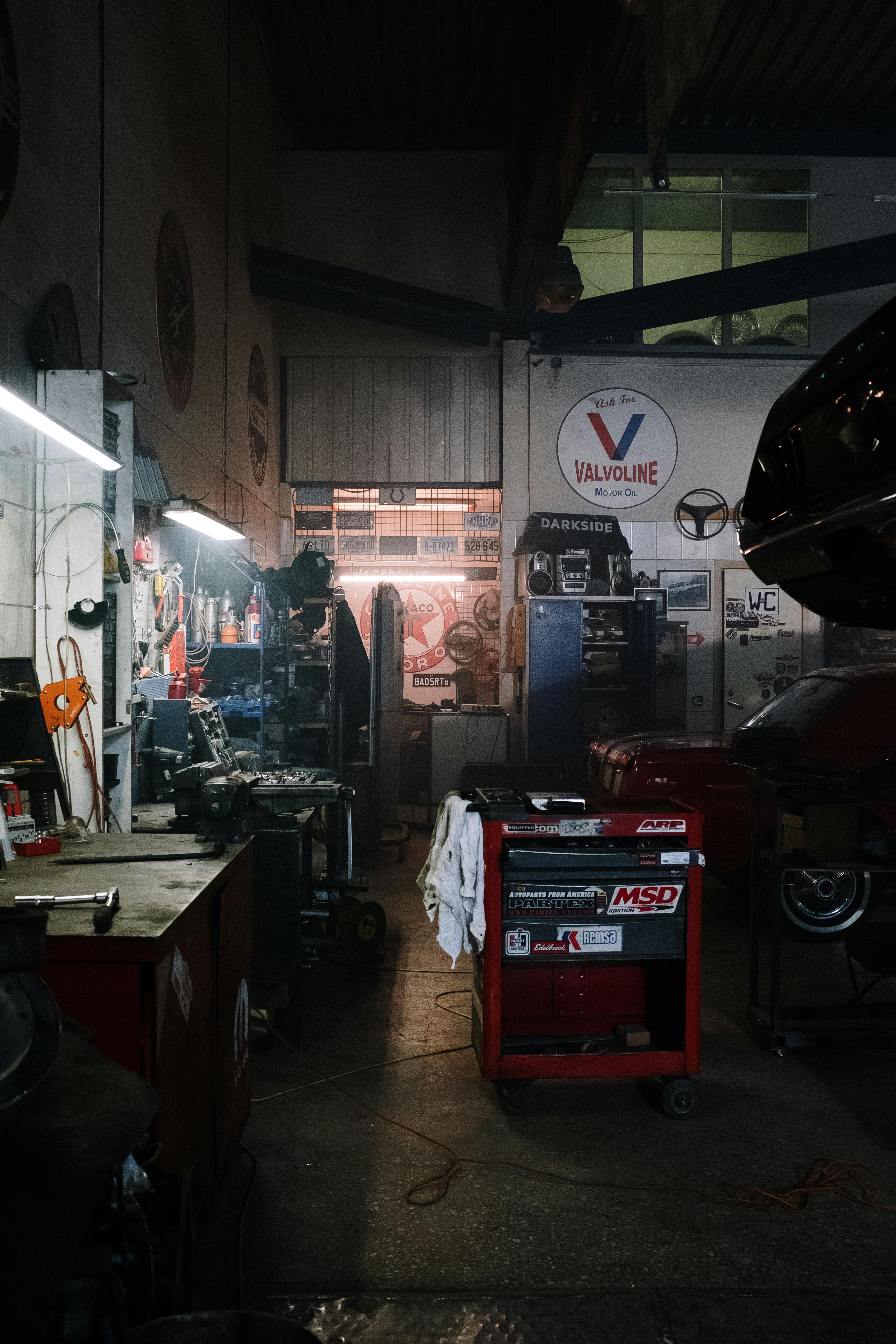 Technician working in a modern automotive service bay
