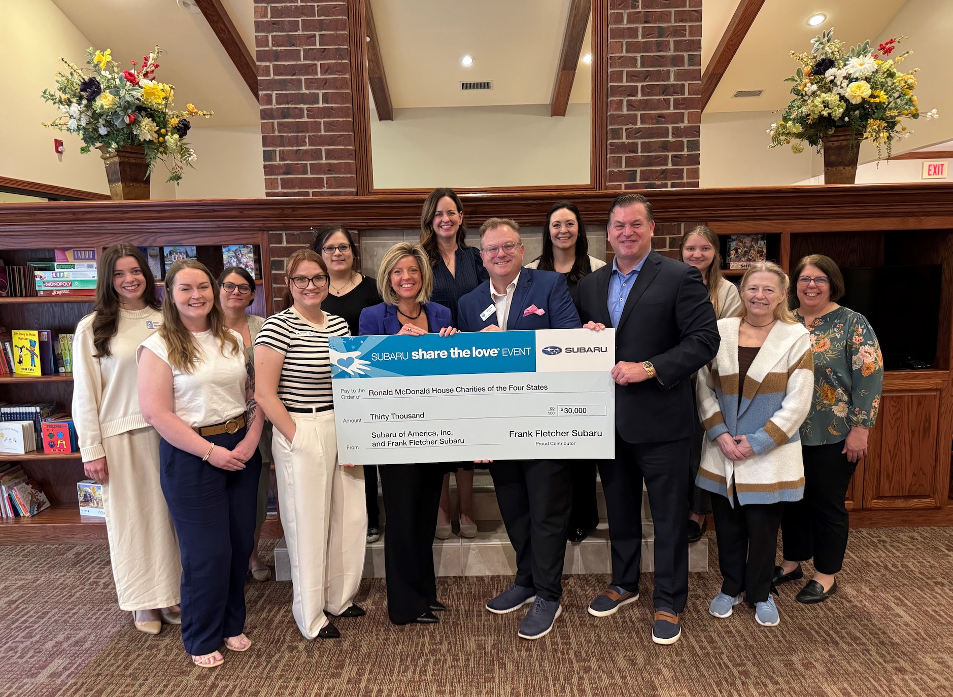 General Manager Josh Kirby, Service Director Ashley Carnes and Fletcher Auto Group V.P. Brent Lobanoff present our donation to the Ronald McDonald House Of The Four States.