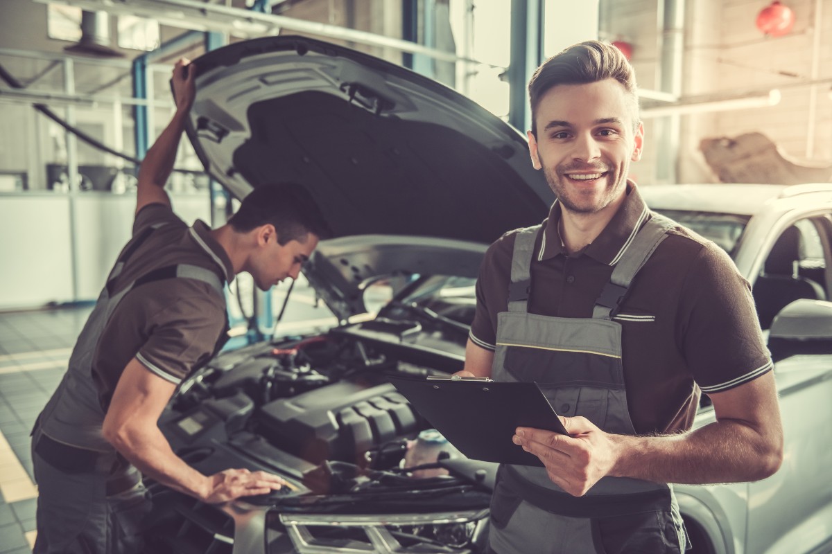 Service Technicians Checking Under Hood