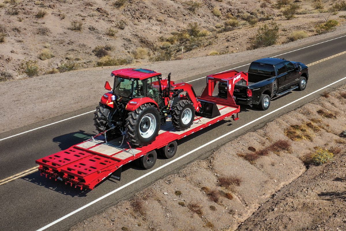 2025 RAM 3500 Exterior Passenger Side Rear Profile while Towing Big Load